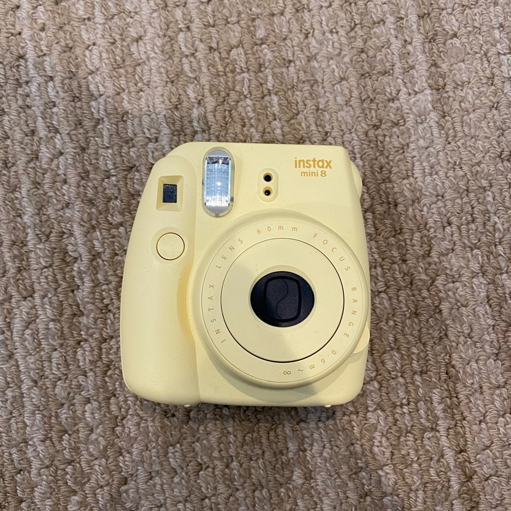 Yellow instax polaroid camera